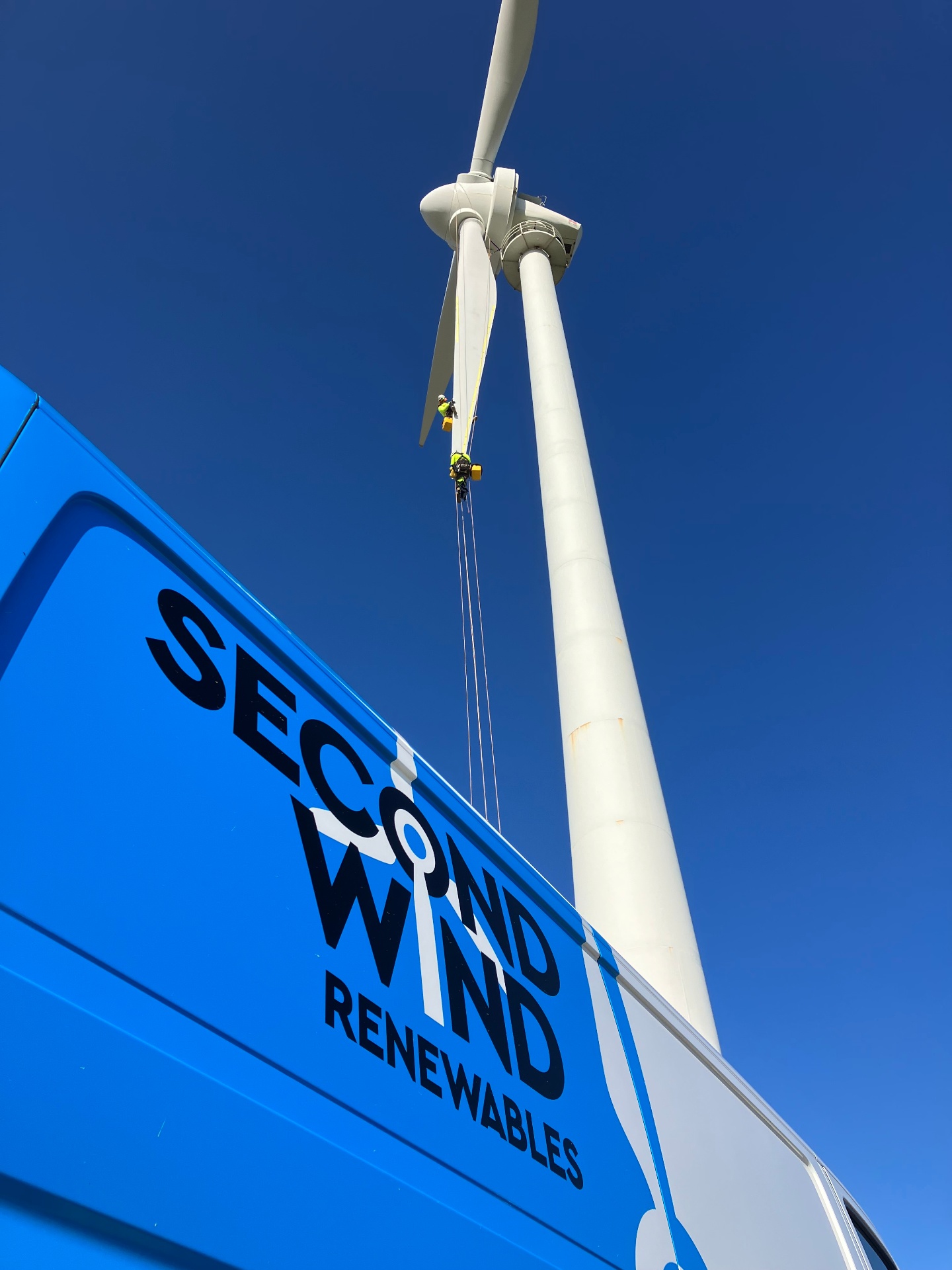Second Wind Renewables technicians performing rope-access maintenance on a wind turbine